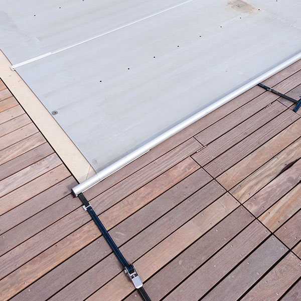 pool which is covered with grey pool tarpaulin