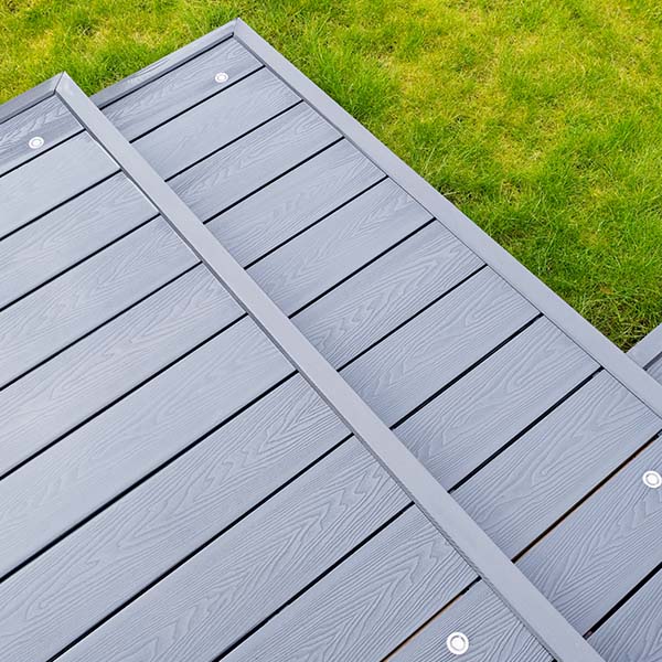 Ash grey composite decking on a rainy wet day